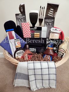 a basket filled with kitchen utensils and other cooking supplies on top of a carpet