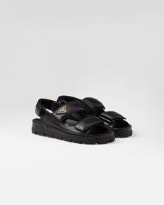 Upper with leather trim Enameled metal triangle logo Rubber sole Lug tread Re Edition Prada, Prada Sandals, Latest Sandal, T Strap Flats, Rubber Sandals, Mens Travel Bag, Leather Thong Sandals, Leather Platform Sandals, Leather Sandals Flat