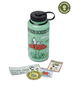 a green water bottle with stickers on the lid and some tags around it that say do you found?