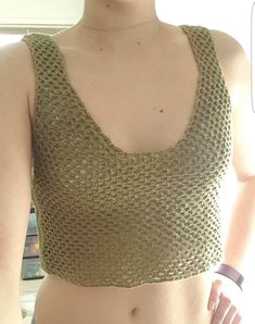 Enjoy the warm weather in this netted crochet crop top. Perfect to pair with your favorite bikini top or a pretty bralette! Details: -Low back -Crochet -Crochet netting throughout Sizing: -Small Measurements: -From top to bottom 15 inches -Circumference of ribcage 32 inches Materials: -Soft cotton acrylic blend yarn Washing Instructions: -Wash in cold cycle and lay flat to dry for best washing results Seamless Cropped Crochet Top For Summer, Summer Open Knit Crop Top For Vacation, Summer Beach Open Knit Mesh Top, Seamless Crop Top For Beach, Summer Beach Mesh Top With Open Knit, Seamless Crop Top For The Beach, Open Knit Crop Top For Beach Season, Seamless Crop Top Tank For Beach, Cropped Open Knit Crochet Top For Vacation