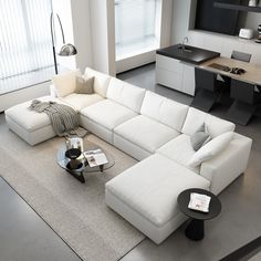 a large white sectional couch in a living room