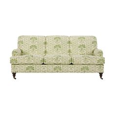 a green and white couch on a white background