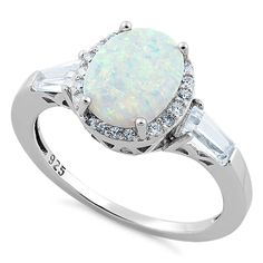 Top of ring height: 11mm
Top of ring width: 18.7mm
Band width: 1.7mm
Shank width: 1.4mm
Stone material: lab created opal & clear cubic zirconia
Center stone size: 10mm x 8mm
Stone shape: oval (center) & round & baguette
Total number of CZ stones: 20
Stone setting: prong setting
Metal: 925 sterling silver
Plating: rhodium plated 
Finish: high polish Engagement Ring Baguette, Unique Diamond Wedding Rings, Morganite Engagement Ring Vintage, Baguette Engagement Ring, Ring Baguette, White Lab, Morganite Engagement Ring, Peridot Ring, Unique Diamonds