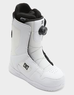 a pair of white snowboard boots with black accents on the bottom and soles