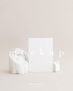 a white box sitting on top of a wooden stump