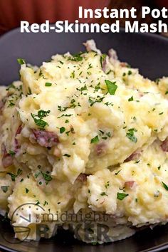 mashed potatoes in a black bowl with parsley on top and the words instant potato red - skinned mashed potatoes