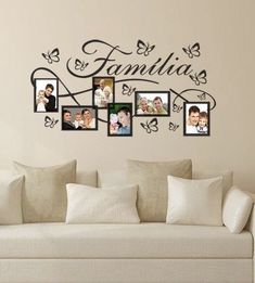 a family photo frame wall decal in a living room with white couches and pillows