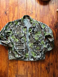 "Thanks for looking!  Awesome jacket! hunting camo cool leaf fall pattern 4 pockets  zips up ykk zipper soft light canvas knit cuffs great Pella label measurements are: 46-48\" chest 20\" across shoulders  28\" length down back  sleeves 20\" long No cancellations.  Sorry we can no longer accept International sales. Please~ DO NOT REQUEST FASTEST SHIPPING IF YOU DO NOT PAY FOR FASTEST SHIPPING! Thanks!" Green Hunting Utility Jacket For Fall, Green Utility Jacket For Hunting In Fall, Green Utility Jacket For Fall Hunting, Camouflage Utility Jacket For Hunting In Fall, Camouflage Utility Jacket For Fall Hunting, Fall Camouflage Utility Jacket For Hunting, Green Fall Hunting Utility Jacket, Camouflage Outerwear With Multiple Pockets For Outdoor, Camouflage Utility Jacket With Pockets For Hunting