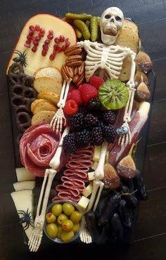 an arrangement of food is arranged in the shape of a human skeleton