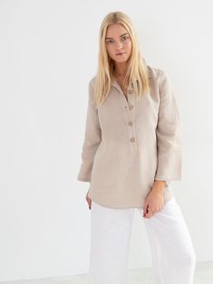 "LARA is a tunic style linen pullover shirt with long sleeves. DETAILS - Tunic style design - Long Sleeves - Collared - 100% midweight European linen fabric - Cut and sewn to order just for you in our studio COLOR - Beige, you can also choose other colors above - Fabric samples are available here https://www.etsy.com/listing/586569696/linen-fabric-samples SIZING & FIT - Length (shoulder to hem) is approximately 28 inches / 71 cm - Bust (pit to pit) is approximately 19 inches / 48 cm - Waist Linen Tunic Shirt, Wide Leg Linen Trousers, Kimono Wrap Dress, Shirt Linen, Studio Color, Tapered Trousers, Linen Tunic, Tunic Style, High Quality Dress