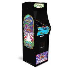 an arcade machine that is black and has colorful graphics on the front, and sides