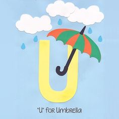 an umbrella is floating in the air over a letter u that says u for umbrella