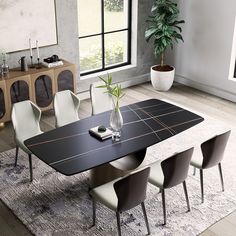 a dining room table with chairs and a potted plant