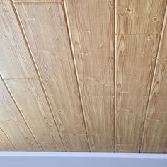 a close up view of wood planks on a ceiling