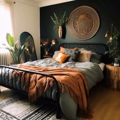 a bed room with a neatly made bed and plants on the wall above it in front of a window