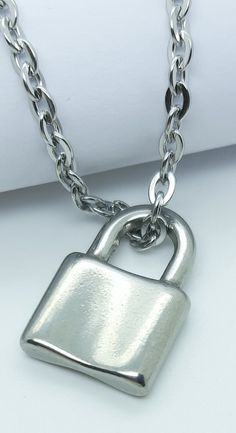 Padlock pendant necklace. Womens mens lock pendant. Fashionable design with choice of chains. Solid steel. Great for everyday casual wear. Best quality 316 stainless steel. Gift for men women birthdays. #lockpendantnecklace #pedlockpendants #womenspadlocknecklace #silverlockpendant #pendantsforwomen #menspendants #giftsforher #stainlesssteelnecklaces #stainlesstseeljewellery #snowstarpendants Lock Pendant, Chain Fashion, Charm Pendant Necklace, Necklace For Men, Birthday Woman, Stainless Steel Pendant, Gift For Men