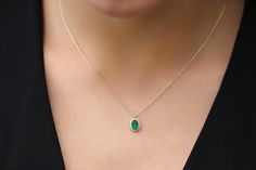 "Emerald Necklace / 14k Classic Oval Cut Emerald with Surrounding Diamonds / Natural Emerald Necklace in 14k Solid Gold / Mothers Day Gift / Birthstone Necklace * If you would like to see the Matching Earrings Please Click Below https://www.etsy.com/listing/604292239/emerald-earrings-14k-oval-cut-emerald?ref=related-4 * If you would like to see the Matching Ring Please click Below https://www.etsy.com/listing/604242111/emerald-ring-14k-classic-oval-cut?ref=related-2&ep_click=1 Item Features Elegant Oval Necklace With Bezel Setting, Elegant 14k Gold Oval Cabochon Necklace, Oval Dainty 14k Stamped Jewelry, Dainty Oval 14k Stamped Jewelry, Dainty Oval Jewelry Stamped 14k, Oval Gemstone Necklace In 14k Gold, Elegant Oval 14k Stamped Necklace, Elegant Oval Cabochon Birthstone Necklace, Oval 14k Stamped Necklaces For Anniversary