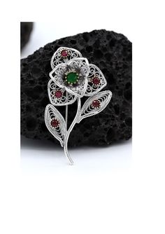 The brooch is made of 925 sterling silver. It is embroidered with filigree art. Natural stones were used in the production of the product. It was sgempecially designed and processed in Mardin. The needle part is also silver. There is oxide on the product. Length: 5.3cm Width: 3cm Traditional Gemstone Brooches For Gift, Traditional Gemstone Brooches As Gift, Intricate Design Brooches As Gifts, Traditional Handmade Sterling Silver Brooches, Ornate Sterling Silver Filigree Brooches, Handmade Ornate Sterling Silver Brooches, Brooch Handmade, Brooches Handmade, Metal Work