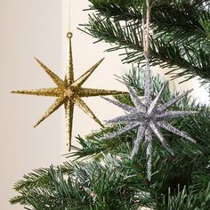 two ornaments hanging from a christmas tree