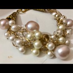 Freshwater Pearls Of Different Luster And Size Are Delicately Weaved With Non Tarnished Gold Wire. It Has Two Gold Cones To Add Texture. Some Pearls Are Small And White And Some Are Larger And Pink. Lots Of Details And A Gold Tone Clasp. Organic And On Trend. One Of A Kind. I Make Only One Piece At A Time. From A Smoke Free Home. Bohemian Pearl Bracelet For Parties, Elegant White Wire Wrapped Pearl Bracelet, White Feminine Bracelets For Party, Feminine White Bracelets For Party, White Feminine Party Bracelets, White Round Beads Feminine Bracelet, White Feminine Bracelets With Round Beads, White Feminine Round Bead Bracelets, Feminine White Round Bead Bracelets