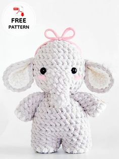 an elephant stuffed animal with a pink bow on it's head is shown in front of a white background