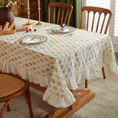 a dining room table with two plates on it