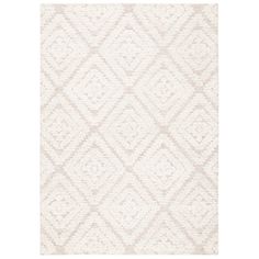 a white rug with diamond shapes on it