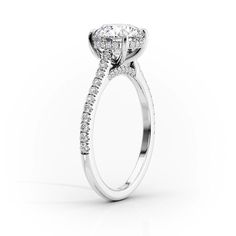 an oval shaped diamond engagement ring with side stones