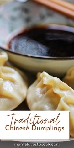 some dumplings are on a plate with chopsticks and sauce in the bowl