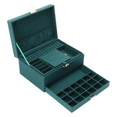 an open green box with several compartments in it