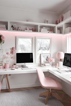 a white desk topped with a computer monitor next to a pink chair and window sill