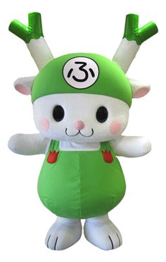 a green and white stuffed animal with numbers on it's chest, standing in front of a white background