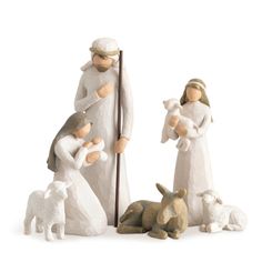 a nativity scene with two figurines and a dog