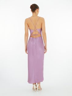 The Riviera in sweet Lavender Violet. Featuring a cowl neck with lace up back detailing, in 100% silky soft recycled fabric. Enjoy. Spring Satin Dress With Back Opening, Spring Evening Ruched Back Slip Dress, Spring Evening Slip Dress With Ruched Back, Spring Purple Dress With Corset Back, Spring Satin Slip Dress With Back Opening, Purple Spring Dresses With Corset Back, Spring Silk Dress With Ruched Back, Spring Backless Slip Dress With Lace-up Back, Cowl Back Slip Dress For Night Out In Spring