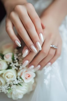 Woman's hands with elegant white manicured nails and a ring, holding a bouquet of white roses. White Nails For Wedding The Bride, Wedding Nails Oval Shape, Nail Art For Wedding Bridesmaid, Bridal Nails Wedding Natural, Nail Design For Engagement, Vintage Wedding Nails For Bride, Bride Almond Nails, Elegant White Nails Classy, Oval Bridal Nails