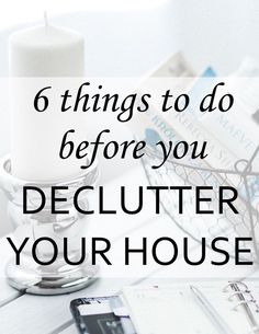 a desk with a phone, pen and notebook on it that says 6 things to do before you declutter your house