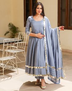 This 3 Pc anarkali Suit set is designed in mul-mul cotton fabric with Gota work mul-mul Dupatta. Kurta Length - 50, Mul-mul Cotton, Gota work With on hem & sleeves. Pant length - 38, Mul-mul cotton. Dupatta - Mul-mul cotton, gota work on edges. Fabric - mul-mul cotton. Color - Grey CARE: dry clean only. Shipping - 10-12 working days. DISCLAIMER - The color of the product may be differ from the image 10-12% due to camera and lights and screen settings of device. Grey Anarkali Suits, Frok Suit Designs, Anarkali Kurta Designs, Grey Anarkali, Desi Pinterest, Cotton Anarkali Suits, Anarkali Designs, Anarkali Dresses, Lace Suit