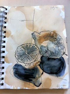 an art journal with watercolors and ink on paper, containing a piece of fruit