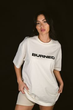 Oversized unisex tee with a screen printed center front logo. Features a 1” collar, dropped sleeves, and top stitched seams. Our signature supima jersey is soft and structured making this a must have. 100% supima cotton jersey Oversized fit 1” high neck Machine wash cold / low tumble dry or flat dry / no bleach Designed in miami / made in los angeles Felix 5’4” is wearing size medium Nicole 5’6” is wearing size medium Playful White T-shirt, Boxy Fit Crew Neck Top With Screen Print, Sporty Drop Shoulder Top With Graphic Print, Spring Streetwear Drop Shoulder Tops, Sporty Drop Shoulder Top With Text Print, Urban Drop Shoulder Tops With Letter Print, Streetwear Cotton Jersey Tops With Logo Print, Oversized Branding Shirt For Streetwear, Oversized Screen Print Tops For Streetwear