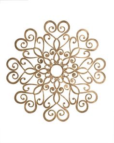 a gold metal snowflake on a white background