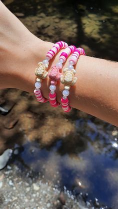 This super cute clay bead bracelet is made with high quality beads. It has a randomized pattern with the colors: -dark pink -light pink  -white.  There is a turtle charm in the center surrounds by a large and small pearl on both sides. You can choose between and a pink and cream colored turtle.  Like this design but want it in different colors? Check out the rest of my Etsy store to find this same bracelet design in blue and purple. Please note that colors and pattern may vary from each bracelet. All bracelets vary from 6.5 inches to 6.75 inches.  While the string I use is high quality, be careful not to overstretch the bracelet as it will shorten its lifespan. In addition, keep out of water as it will shorten the lifespan of the bracelet. Excessive sweating and water exposure may also rus Casual Pink Hand-strung Friendship Bracelets, Cute Pink Round Beaded Bracelets, Pink Hypoallergenic Beaded Bracelets For Beach, Pink Hypoallergenic Bracelets For The Beach, Hypoallergenic Pink Beaded Bracelets For Beach, Hypoallergenic Pink Bracelet For Beach, Hypoallergenic Pink Bracelets For The Beach, Hypoallergenic Pink Friendship Bracelets For Beach, Pink Turtle