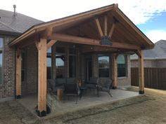 a covered patio with chairs and tables on it