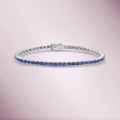 Make heads turn with our gorgeous blue sapphire tennis bracelet. Take advantage of our 10% OFF when you order. FREE shipping on all orders in the United States. Sapphire Tennis Bracelet, Dream Wishlist, Deep Blue Color, Wrist Wear, Sapphire Bracelet, Yellow Gold Bracelet, Travel Jewelry, Jewelry Packaging, Gold Set