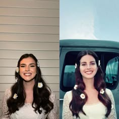 two women with flower in their hair, one wearing a white dress and the other smiling