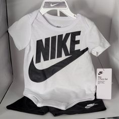 Description: "Dress Your Little One In Style With This Adorable Nike 2-Piece White Onesie Set Featuring Comfy Black Shorts! Perfect For Warm Days, This Outfit Combines Fun And Functionality. The Soft Fabric Ensures All-Day Comfort, While The Iconic Nike Logo Adds A Trendy Touch. Set Includes: Onesie: Classic White With Nike Branding Shorts: Stylish Black Shorts For A Sporty Look Details: Brand: Nike Condition: Brand New With Tags Size: 6 Months Material: Soft Cotton Blend For Ultimate Comfort Th Nike Branding, White Onesie, 6 Month Baby, Baby Outfit, Sporty Look, Baby Month By Month, Black Shorts, Nike Logo, Classic White