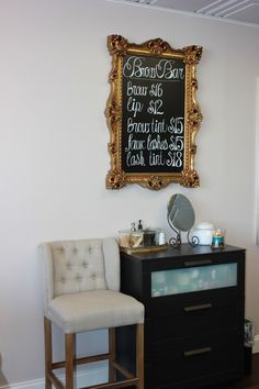 a room with a chair and a chalkboard on the wall