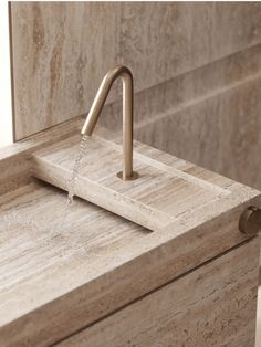 a bathroom sink with a faucet running water from it's spout