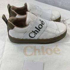 Brand New! Chlo Lauren Logo Strap Sneakers. Size 36. Fits True To Size. Comes In Original Packaging. All Reasonable Offers Accepted. Thank You! Spring Leather Sneakers With Logo, Leather Slip-on Sneakers With Logo, Spring Sneakers With Logo Print, Designer Slip-on Sneakers With Round Toe, Chic Slip-on Sneakers With Round Toe, Strap Sneakers, Chloe Shoes, Womens Shoes Sneakers, Chloe