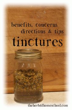 a jar filled with herbs sitting on top of a wooden table next to a sign that says benefits, concerns, directions & tips