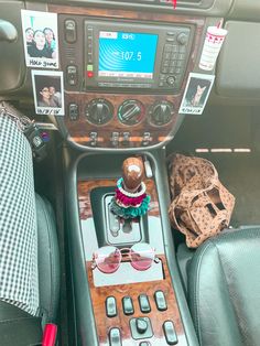 the interior of a car with an old radio and other items on the dash board